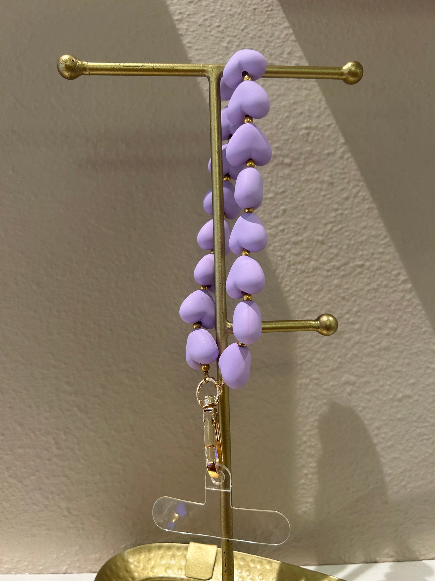 Universeel telefoonkoord hartjes mat lila