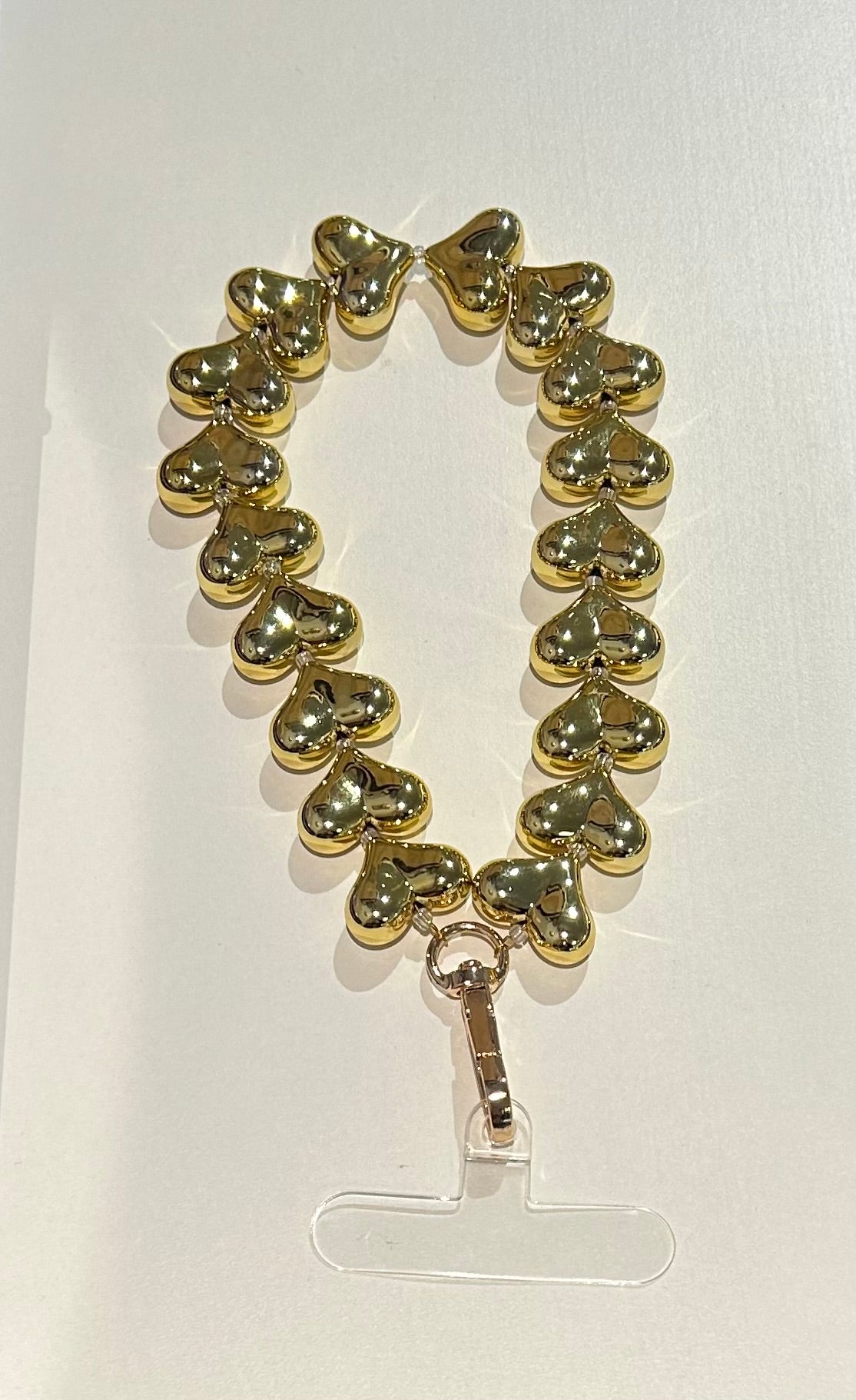 Telefoonkoord hartjes goud